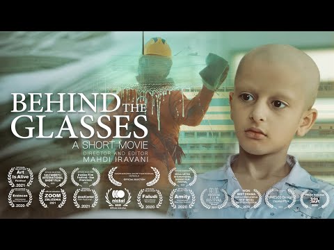 BEHIND THE GLASSES