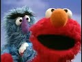 Elmo S World Squishing The Air Out Of A Beach Ball