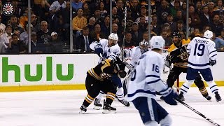 Marchand ducks, Rielly takes all of a Chara slap shot to face