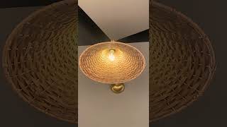 The New Savannah Adjustable Arm Wall Light with Large Bell-Shaped Rattan Shade from Mullan Lighting