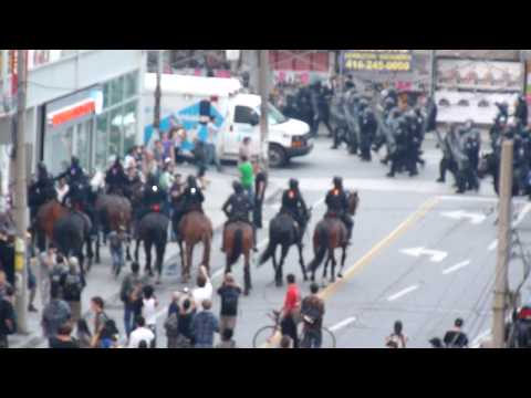 Toronto Riot Police and Mounted Unit Swarm G20 Protesters and Bystanders