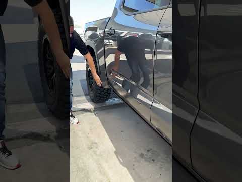 AMP Research PowerStep Running Boards On Lifted Tundra