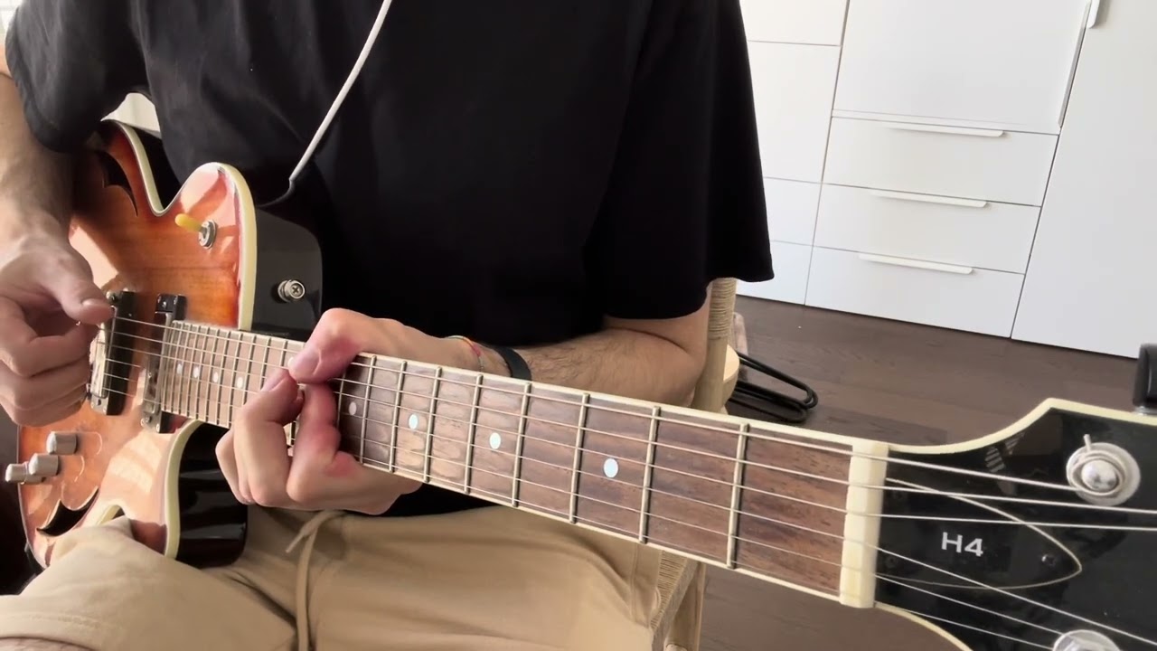 Guitarist comping Autumn Leaves chords with the bass note on the low E string