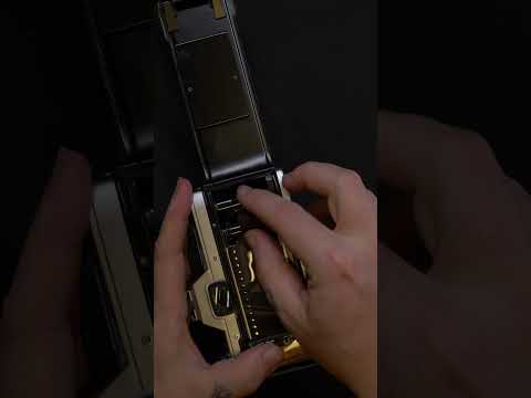 Loading film into an Olympus OM-10 Film Camera