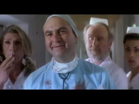 Official trailer thumbnail for The Adventures of Priscilla, Queen of the Desert showing the trio and the desert road