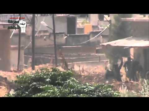 لقطة ثابتة ترصد الاشتباكات في حاجز الجلمة في ريف حماة ضمن مجريات معركة لأجلكم