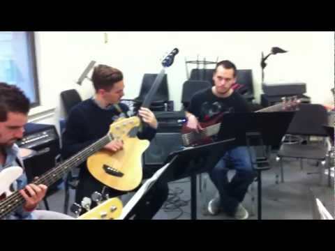"Bass Ensemble Group"  plays Michael Manring solo.  Class taught by Jim Stinnett at Berklee.