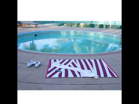 Sky blue and white printed waterproof outdoor rug, packaging...