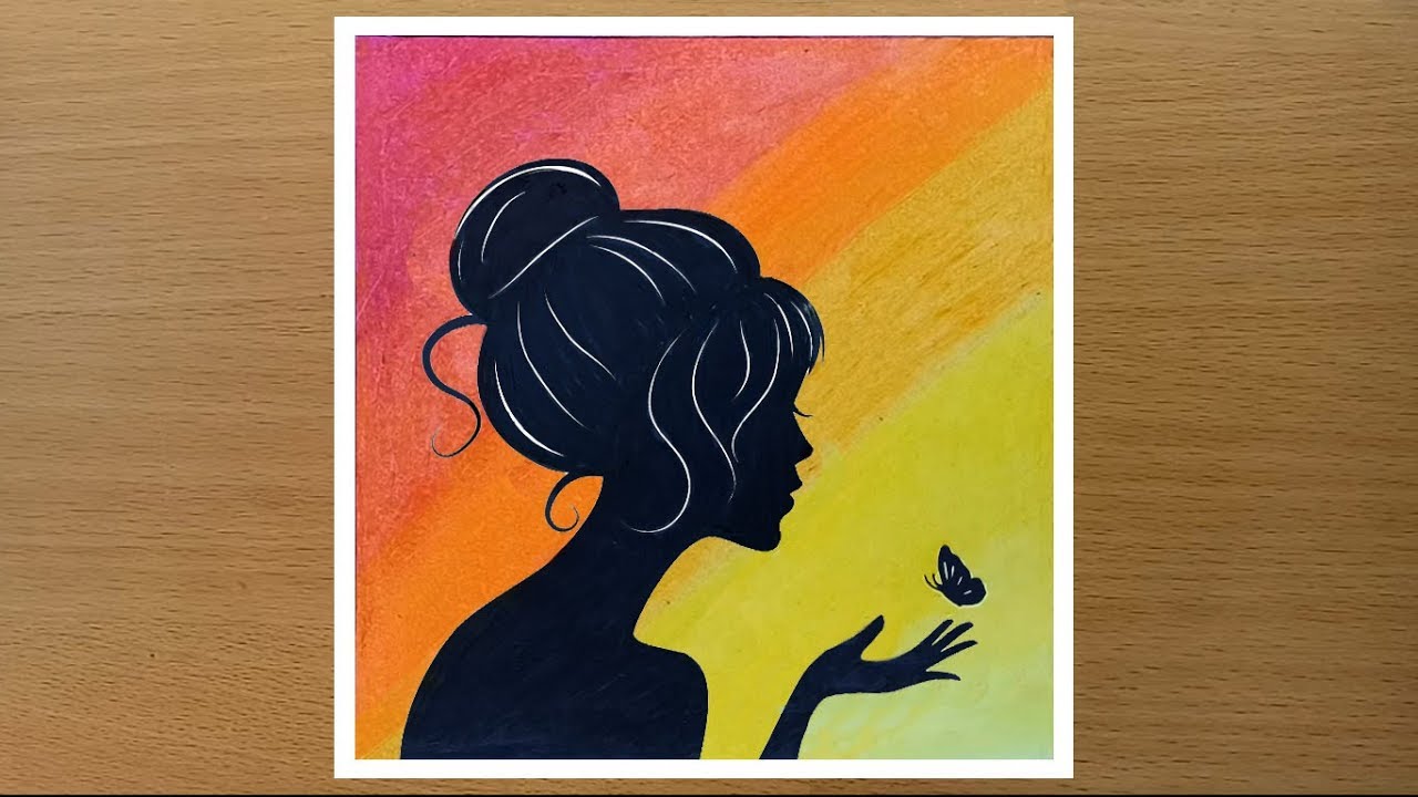 Girl with butterfly drawing using oil pastels