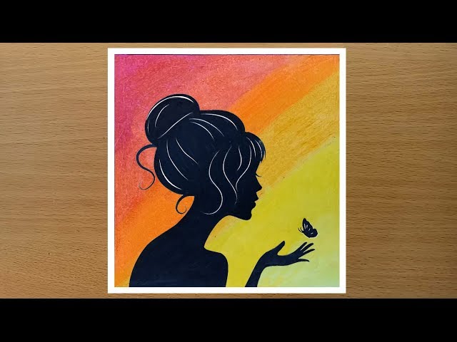 Girl with butterfly drawing using oil pastels