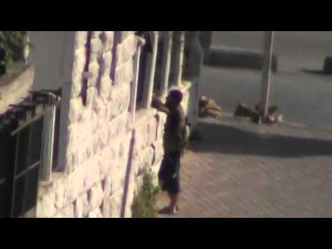 Aleppo :: The moment an Assad soldier is sniped in the Al-Midan neighborhood 08-25-2012