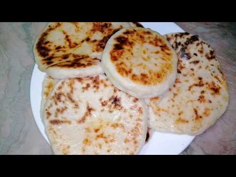 Khachapuri. Georgian cheese bread. Khachapuri with suluguni cheese in a fry pan. Baking. Home bread