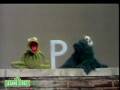 Sesame Street Kermit Shows The Letter B To Cookie Monster
