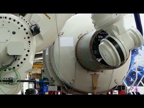 System for high precision assembly of heavy parts, using a FANUC M-2000iA/2300 robot / BEC Robotics
