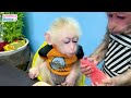 Фото BiBi helps dad go fishing with baby monkey Obi