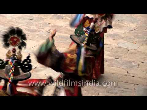 Bhutanese people witnessing the Shana Cham dance in Bhutan