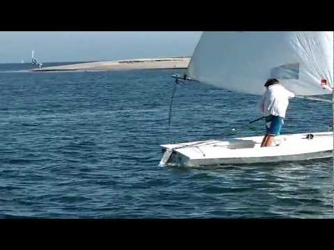 Evan sailing backwards in a laser