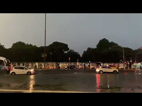 6:20 a.m. Raining and lightning while waiting for  the airport bus.