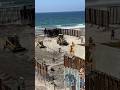 Video shows migrants in Tijuana running through border fencing inside Friendship Park at the border