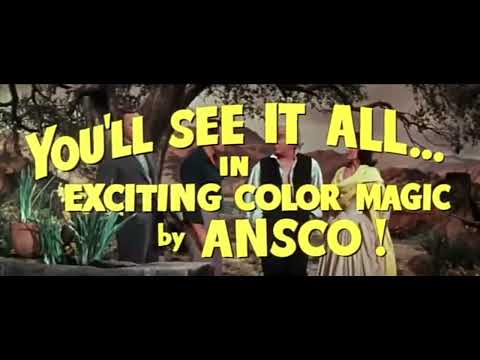Trailer frame of the village square bustle underscored by chorus and dance music