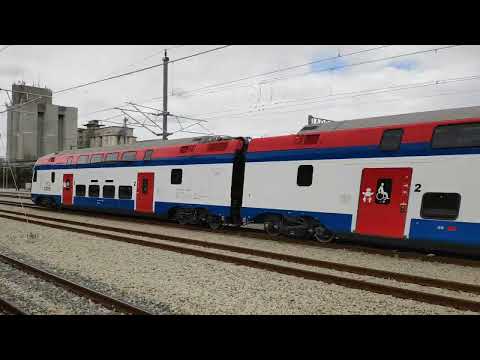 Soko IC train Stadler KISS passing the rail station Indjija from Belgrade, Serbia