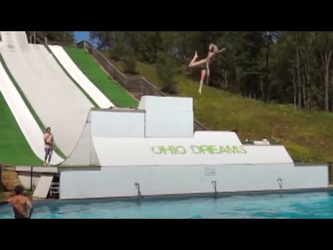 Girl Does A Slide Belly Flop Into Water
