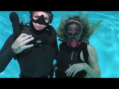 Female Divers are Diving with Smooth Skin Wetsuit