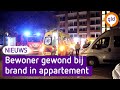 Bankstel vliegt in brand in appartement, bewoner gewond