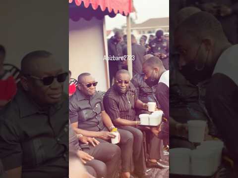 Dr. Despite and his brothers enjoying coconut drink at a funeral grounds