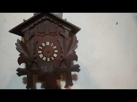 Antique cuckoo clock with couple that twirl around dancing. 20211224 181228