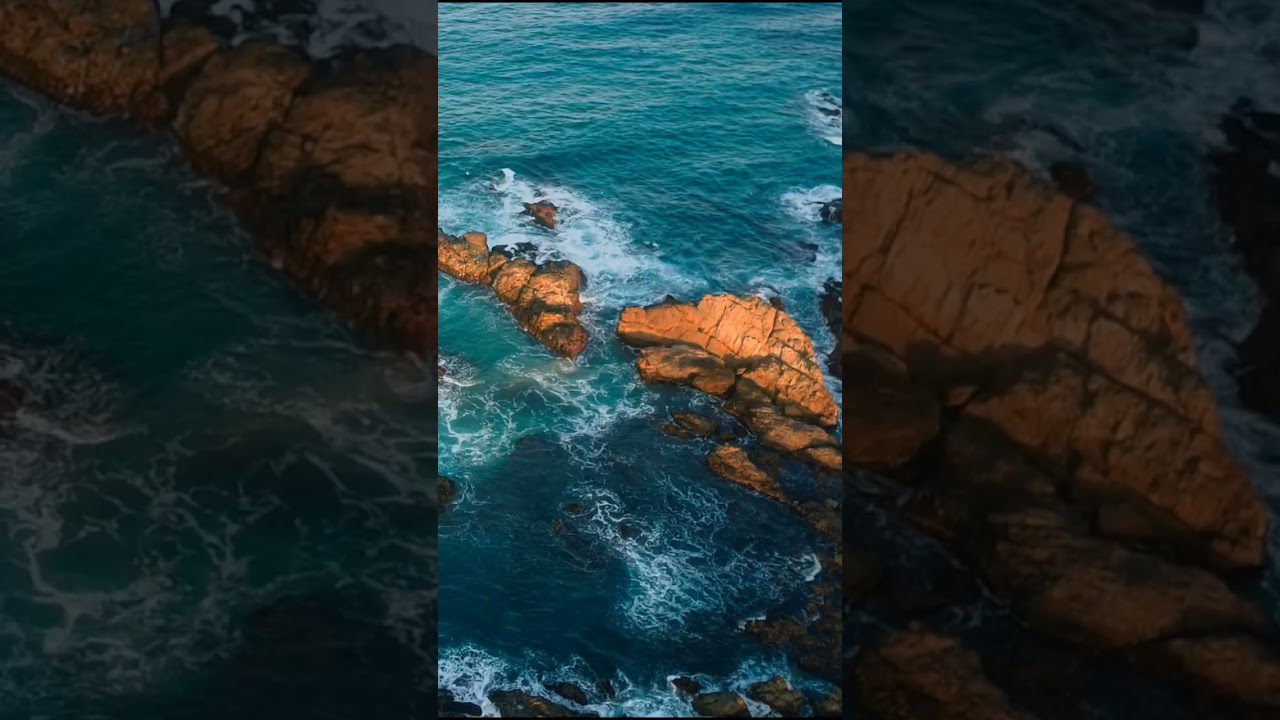 Waves Breaking Over Rocks at Sunset #ocean #beach #waves #coastalmagic #dronefootage