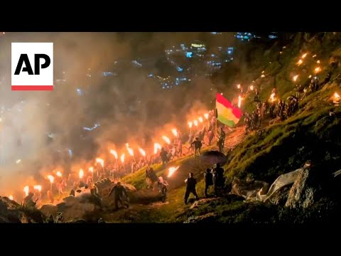 Iraqi Kurds celebrate Newroz by carrying torches and fireworks