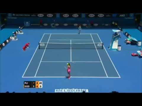 Océane Dodin loses her racket during a serve