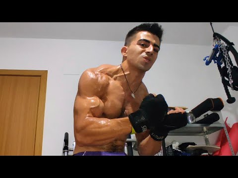 Young muscle guy flexing