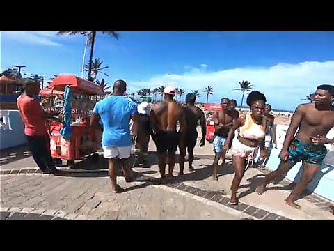 BEACH WALK-ONLY IN SOUTHAFRICA DURBAN - WOMEN IN BIKINI MAN IN SHORTS (fully packed beach
