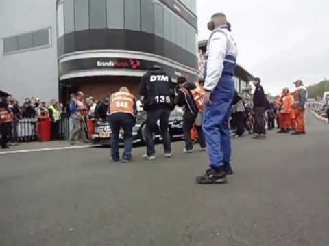 Button exits the pit lane at Brands Hatch in a Mercedes DTM car.