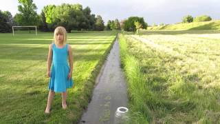 Kids playing in water, near the house