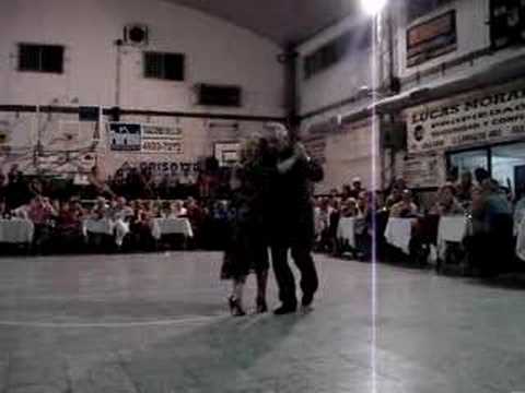  Carlos Perez  and  Rosa Forte  are  dancing  to  a  tango