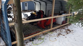 Building a back wall on a metal carport.