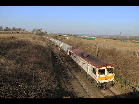 GBRf 66721 'Harry Beck' passes Caistor St Edmund with 6A32 loaded tanks