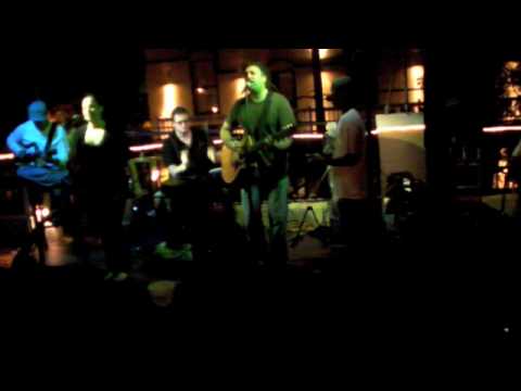 Tony Roberts band performing their song, 