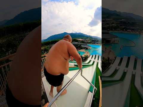BIG MAN slip’n’slide jump at Blue Tree Phuket Thailand 😳 | #watermagic #waterpark #swimming