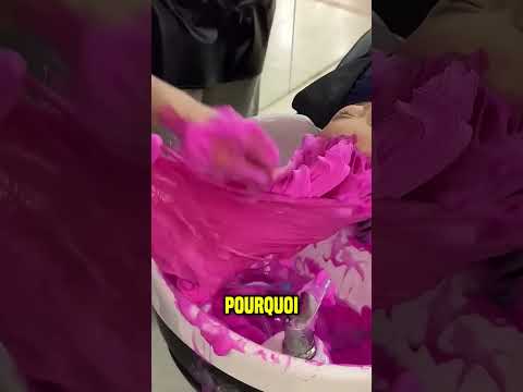 The girl has a pink hairstyle