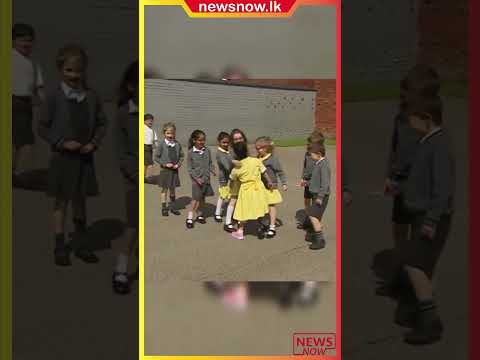 Little girl shows her prosthetic leg to her friends at school