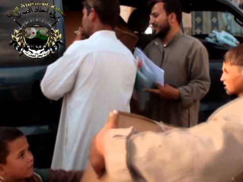 توزيع المعونات للعائلات المقيمة في المدارس من قبل الفرقة 77 في ريف حلب