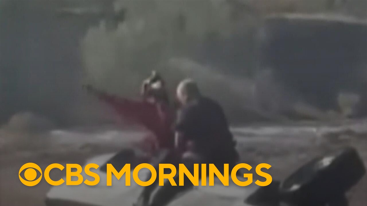 Video shows daring helicopter rescue after Arizona man's truck gets stuck in floodwaters