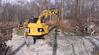 preview picture of video 'Hickory Homes CAT 321D Constructing Paddle Court'