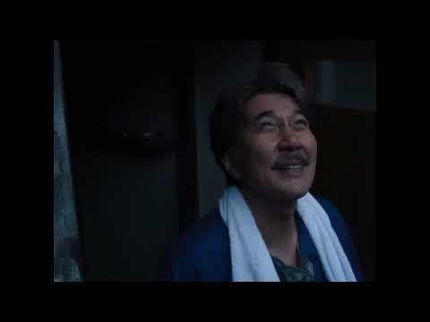 Trailer end card — Hirayama’s van in late sun as a tape flips to Side B