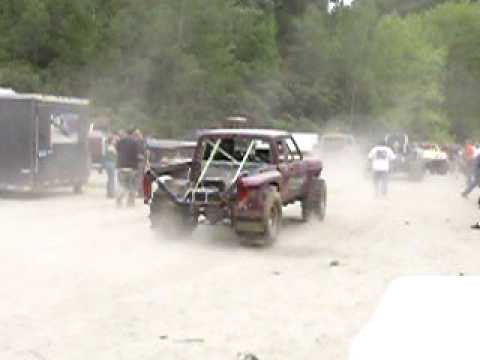 monson hill climbs, really fast  purple truck in pits