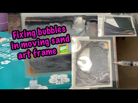 Fixing bubbles in moving sand art frame